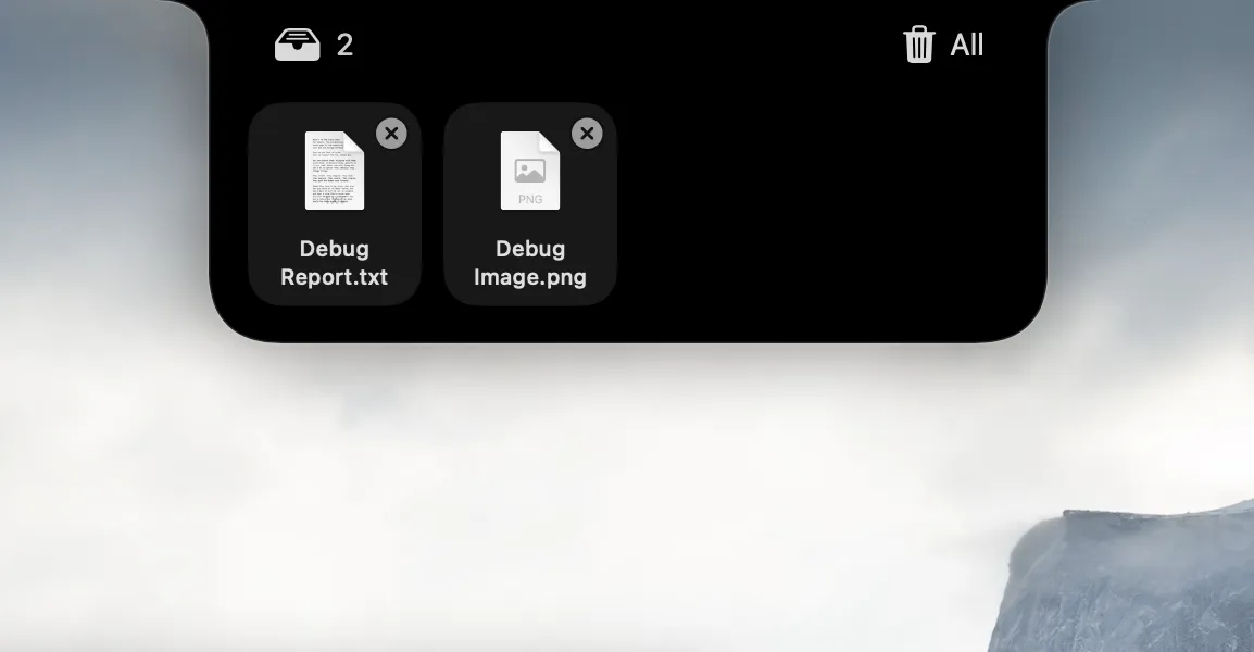 The NotchMind file tray showing Debug Report.txt and Debug Image.png with individual remove buttons.