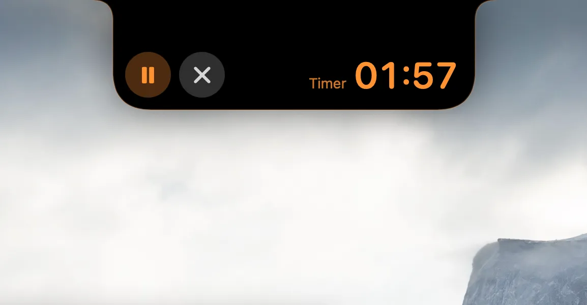 The NotchMind timer showing 01:57 remaining, an orange pause button and a stop button.